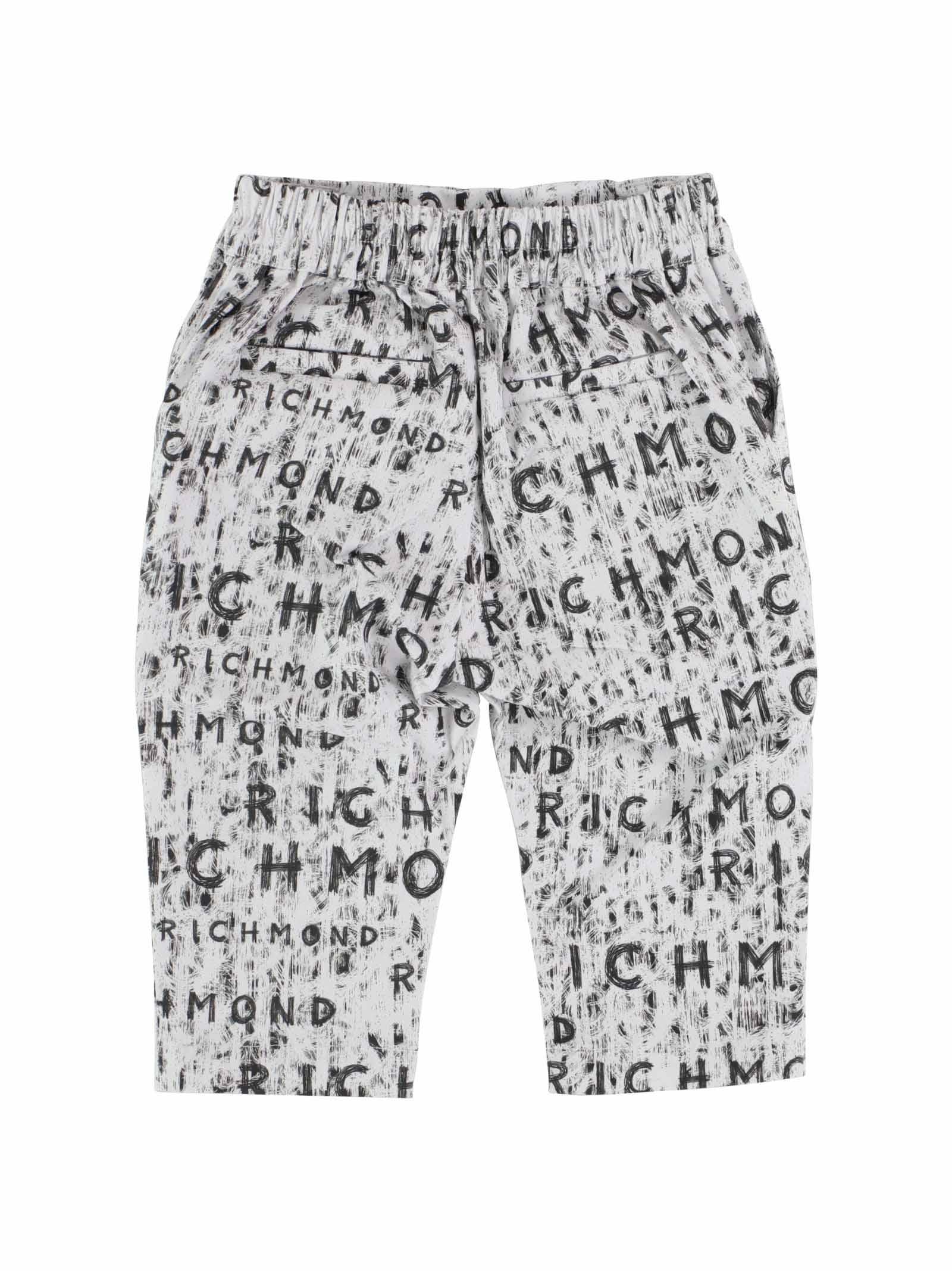 Pantaloni bianchi con scritta graffiti nera all over - Image 2